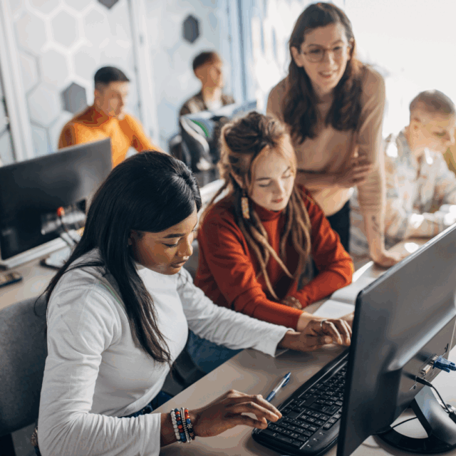 Teen entrepreneurs learning business skills in a youth development program.