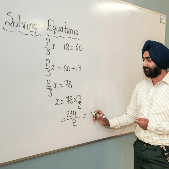 student learning algebra equations with workbook and notes